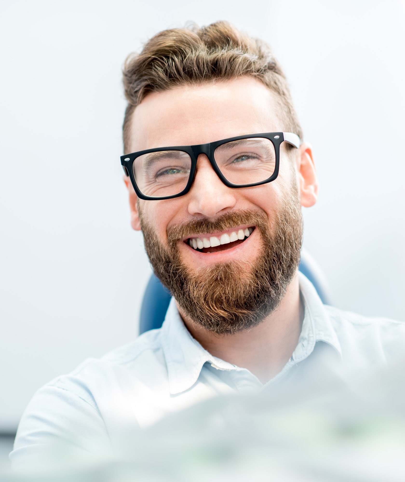 Smiling adult patient during a friendly orthodontic consultation Smiling adult patient during a friendly orthodontic consultation